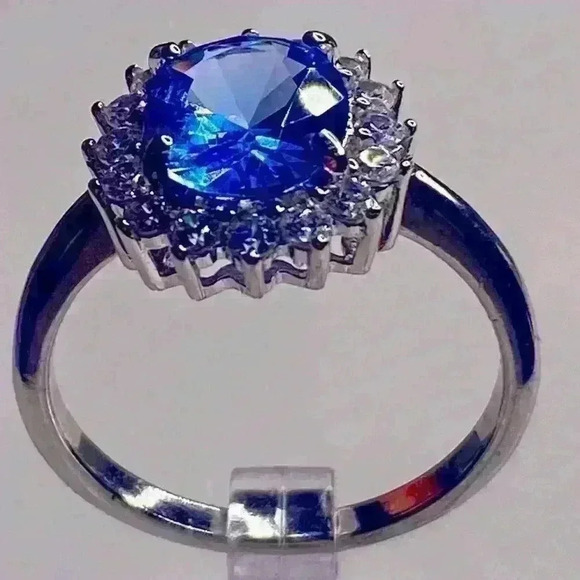 STERLING SILVER BLUE TOPAZ & SIMULATED STONES SET AROUND CENTER. - Picture 1 of 4